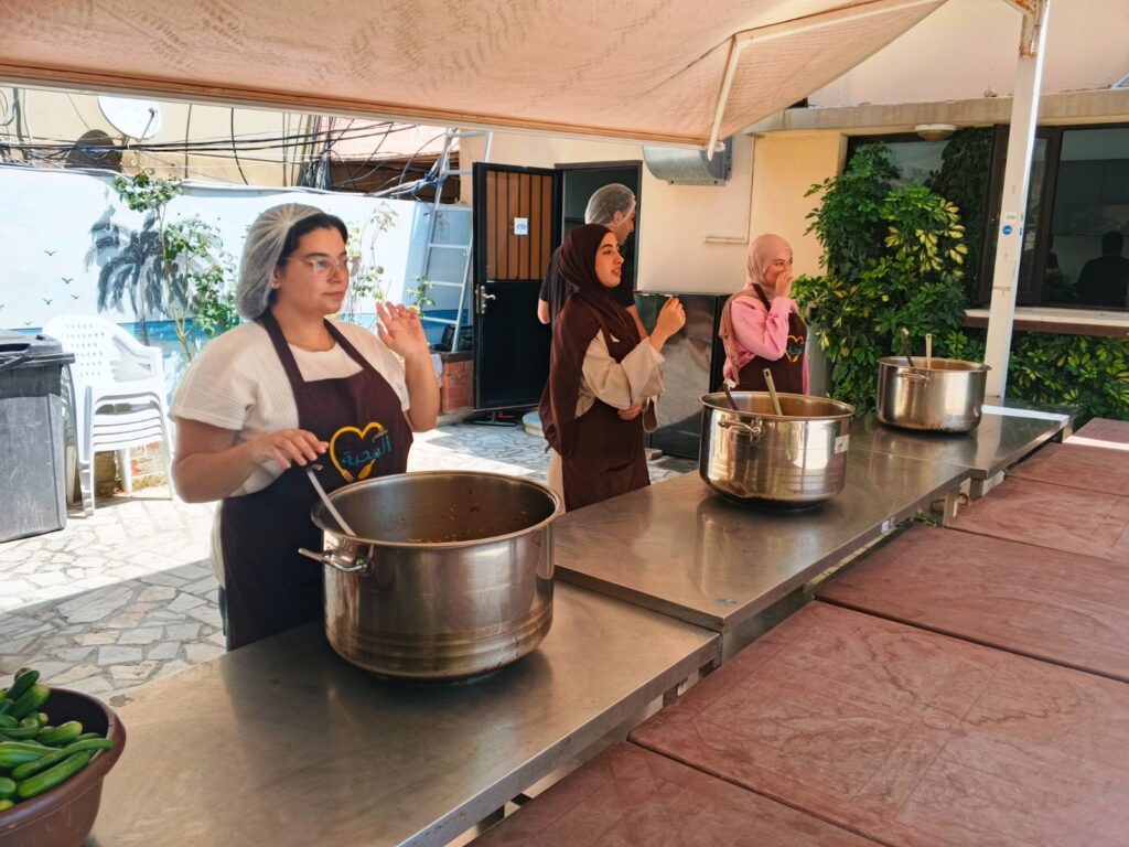 WAY volunteers taking part in the preparation and distribution of meals.