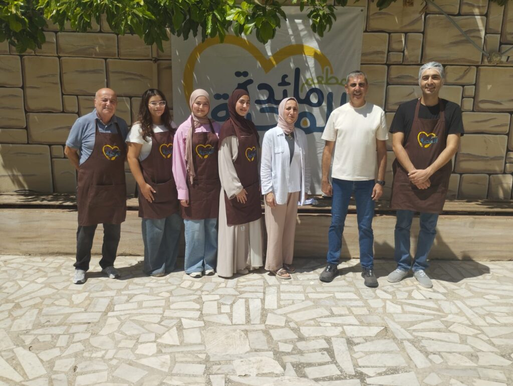 WAY team members and volunteers with the Maedat Al Mahabba team following the activity.